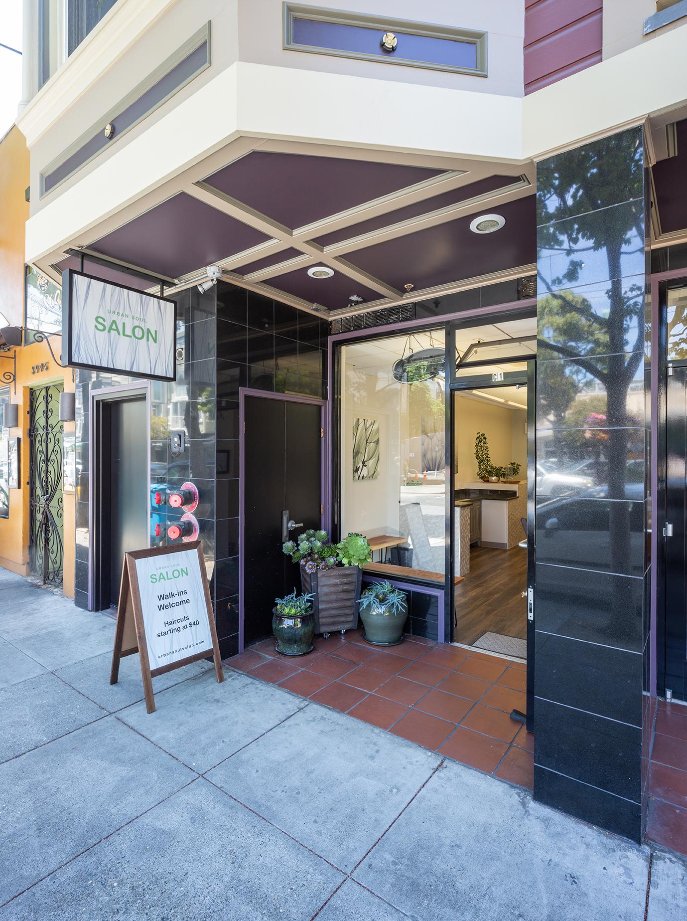 View of the outside of the salon with new signs