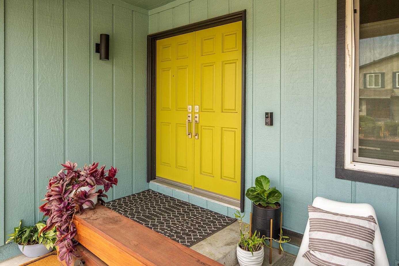 Front door with new mat and porch light