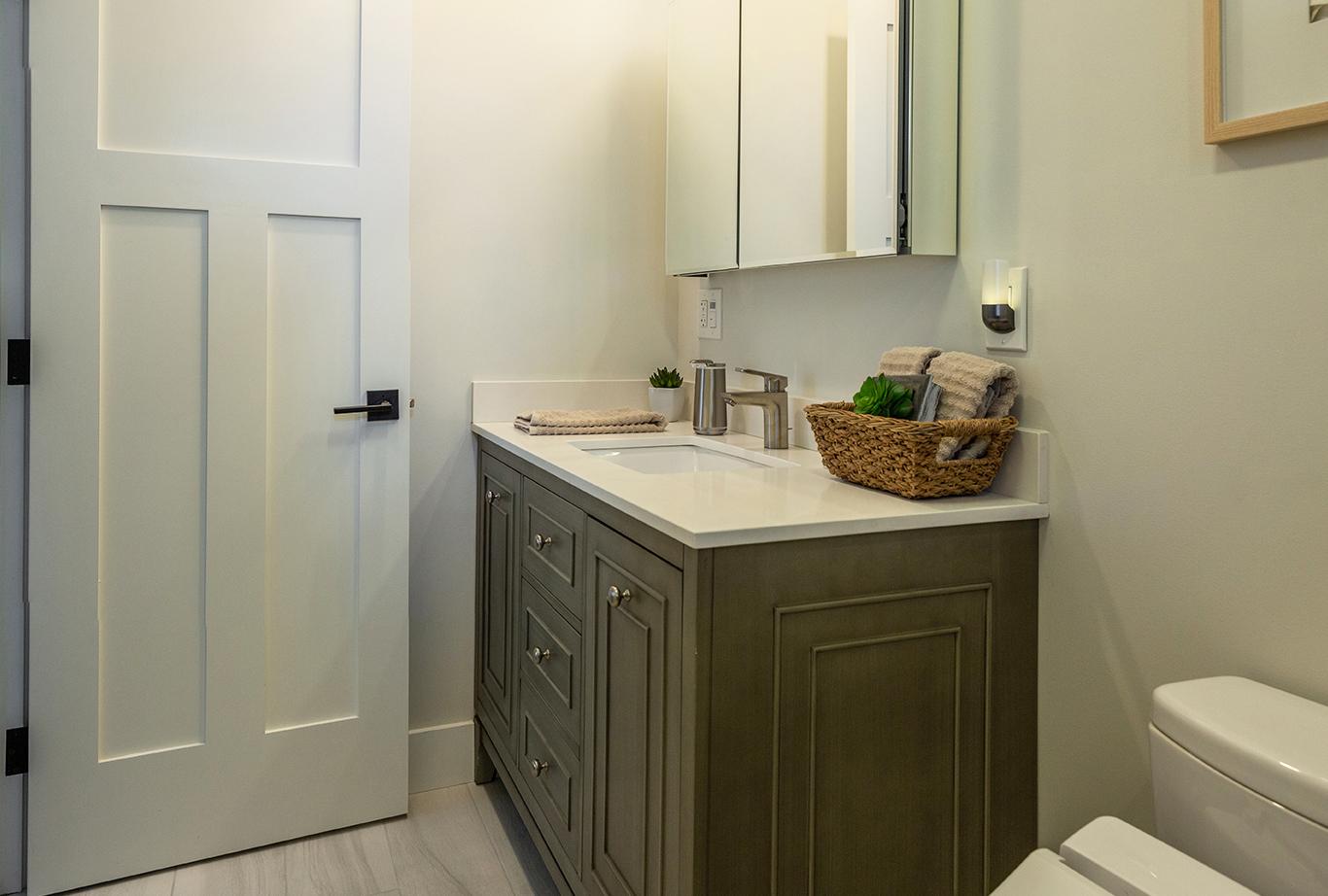 Vanity and bathroom door in master bath