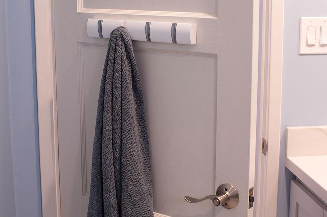 Towels are hung behind the door